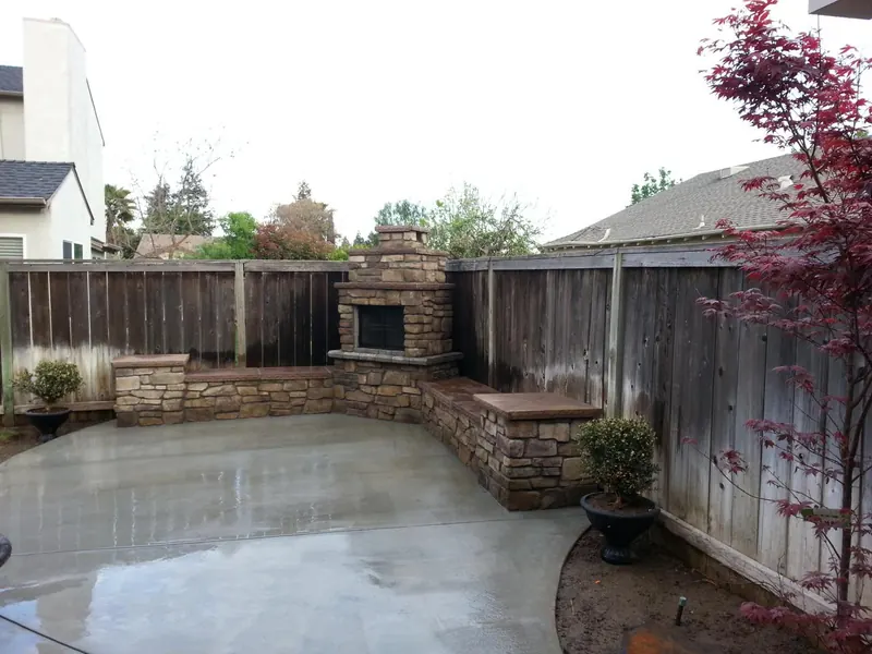 Backyard fireplace and seat wall by Brickhouse Masonry, Central Valley CA