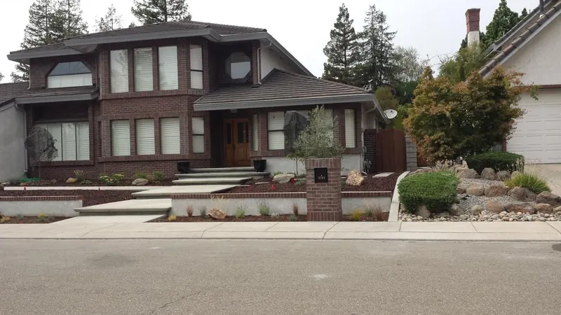Brick home with raised planters by Brickhouse Masonry, Central Valley CA