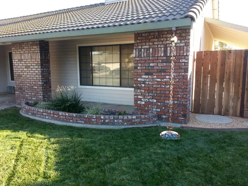 Brick wainscot and planter by Brickhouse Masonry, Central Valley CA