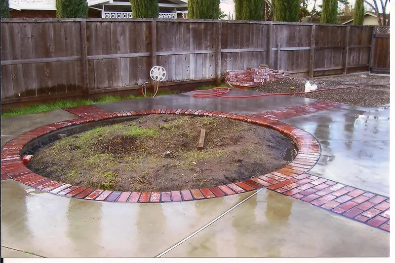 Concrete patio with brick border by Brickhouse Masonry, Central Valley CA