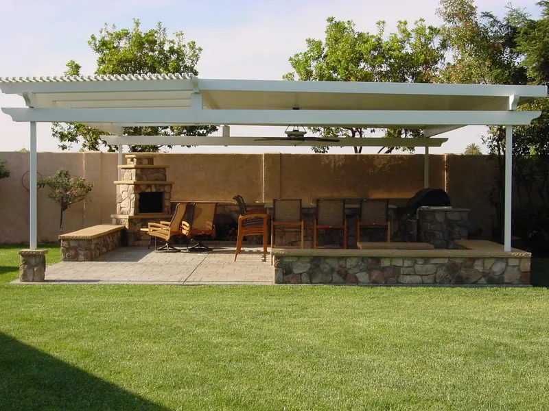 Covered patio with fireplace and outdoor kitchen by Brickhouse Masonry, Central Valley CA