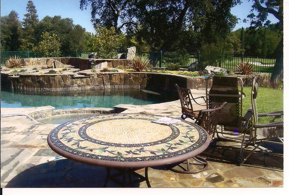 Flagstone pool deck and stone spa by Brickhouse Masonry, Central Valley CA