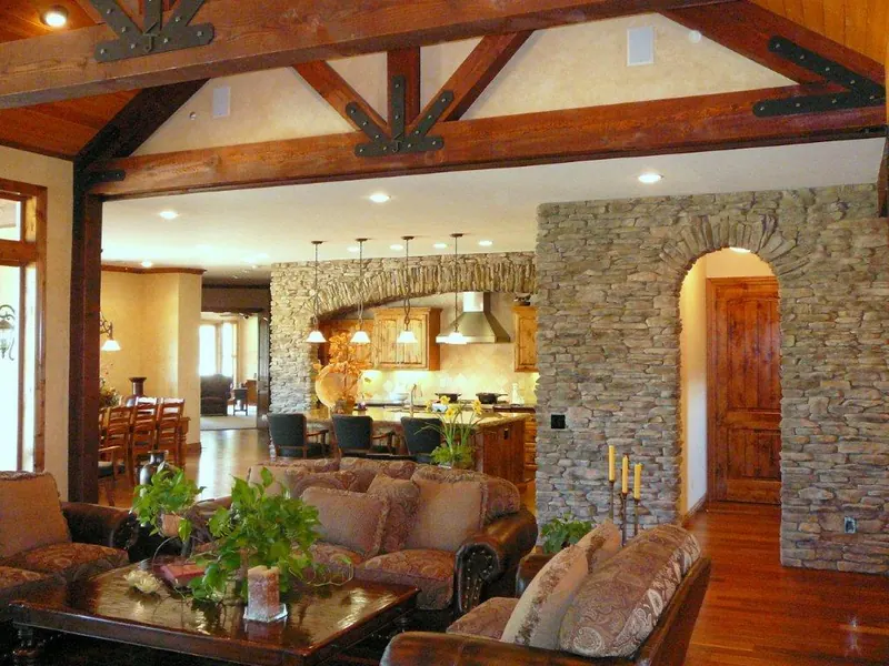 Great room with stone walls and arches by Brickhouse Masonry, Central Valley CA