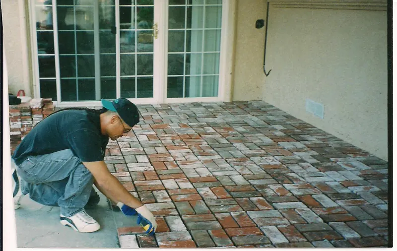 Laying a brick paver patio by Brickhouse Masonry, Central Valley CA