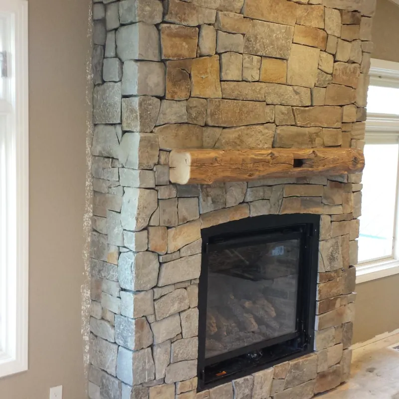 Ledgestone fireplace with wood mantel by Brickhouse Masonry, Central Valley CA