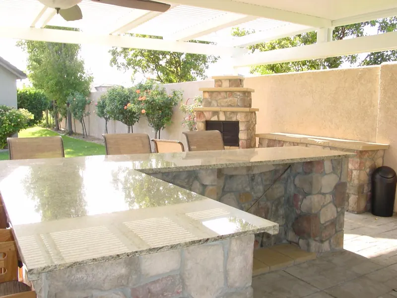 Outdoor kitchen bar and fireplace by Brickhouse Masonry, Central Valley CA