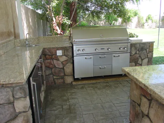 Outdoor kitchen with granite counters and stone base by Brickhouse Masonry, Central Valley CA