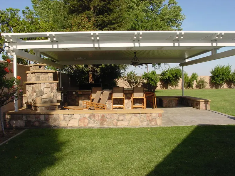 Patio cover with fireplace and seating by Brickhouse Masonry, Central Valley CA