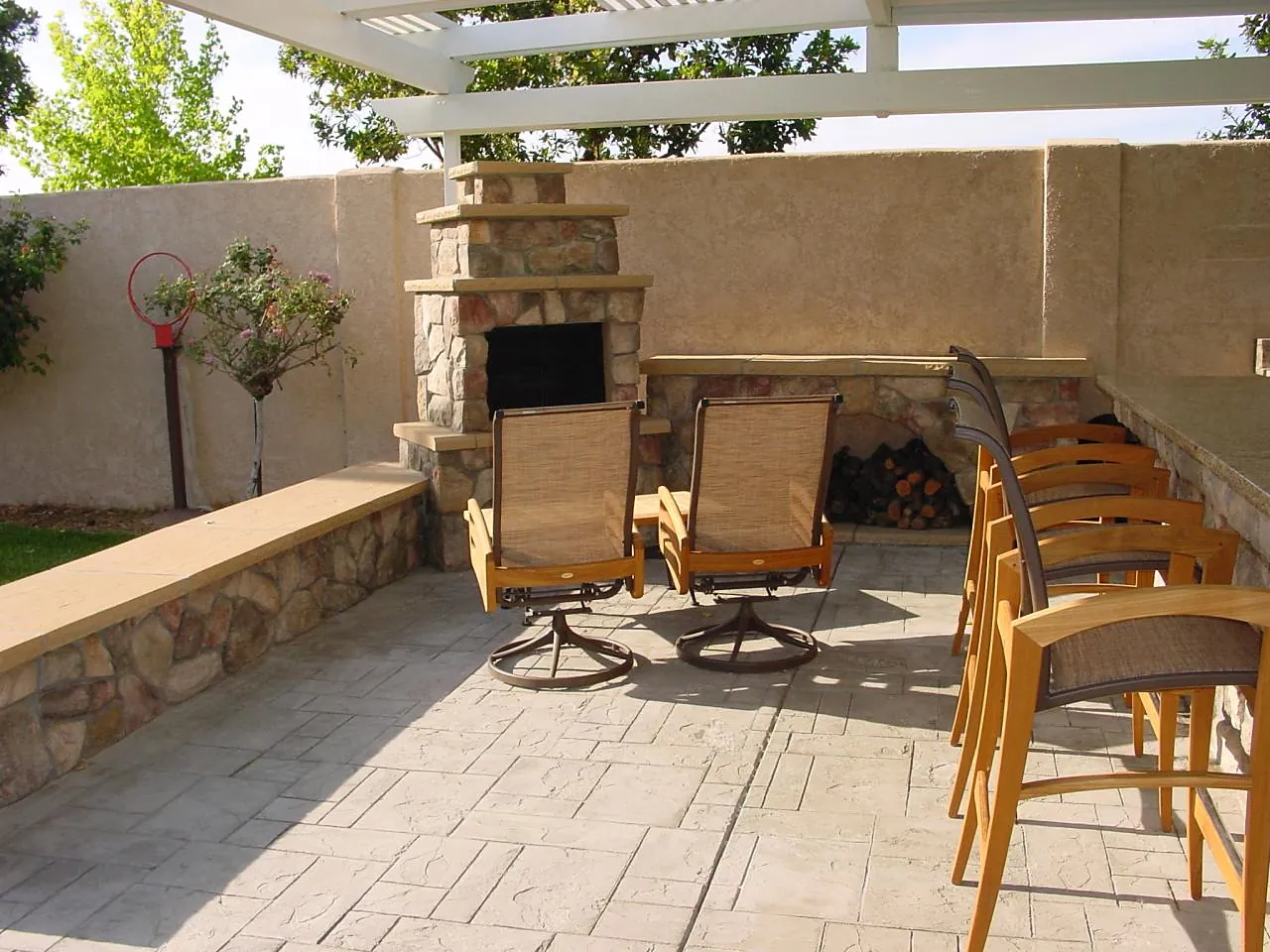 Stamped concrete patio with outdoor fireplace by Brickhouse Masonry, Central Valley CA