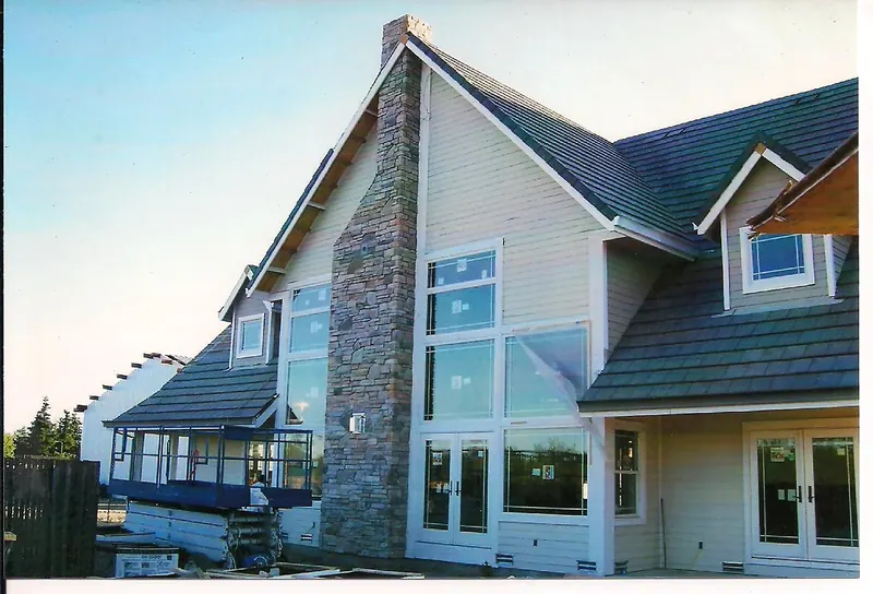 Stone chimney on a two-story home by Brickhouse Masonry, Central Valley CA