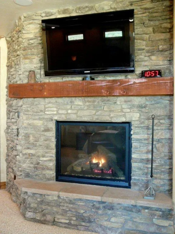 Stone fireplace and TV wall by Brickhouse Masonry, Central Valley CA
