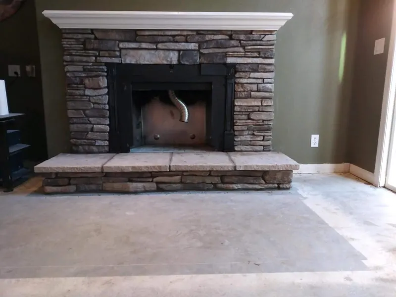 Stone fireplace with raised hearth by Brickhouse Masonry, Central Valley CA