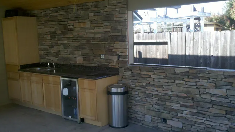 Stone veneer outdoor kitchen wall by Brickhouse Masonry, Central Valley CA